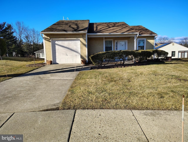 view of front of house with a garage and a front lawn