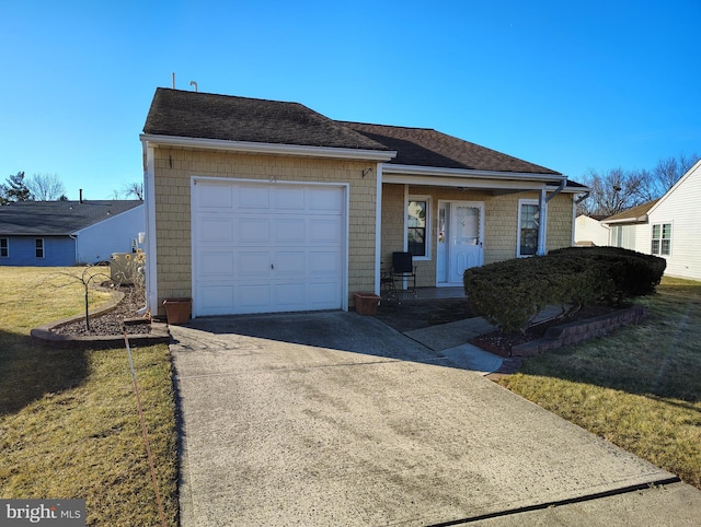 view of front of home with a garage and a front yard