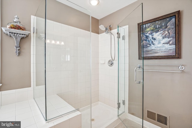 bathroom featuring an enclosed shower