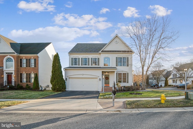 view of front of home featuring a garage and a front yard