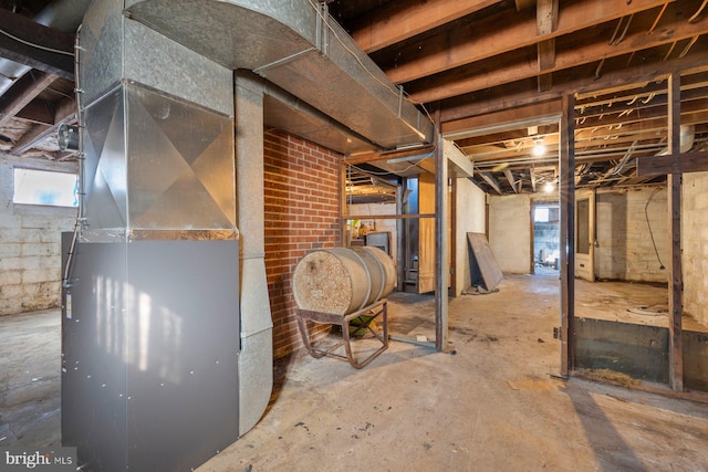 basement featuring heating unit and heating fuel