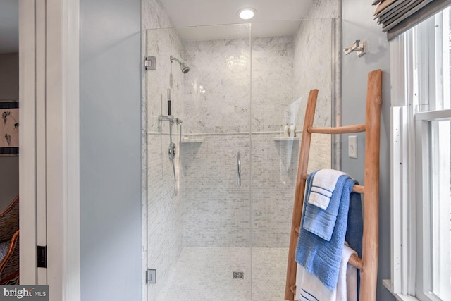 bathroom with a shower with shower door