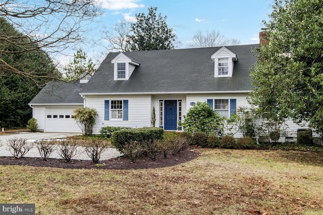 cape cod-style house with a garage and a front yard