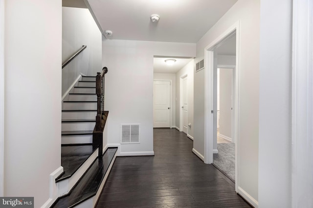 hallway featuring dark hardwood / wood-style flooring