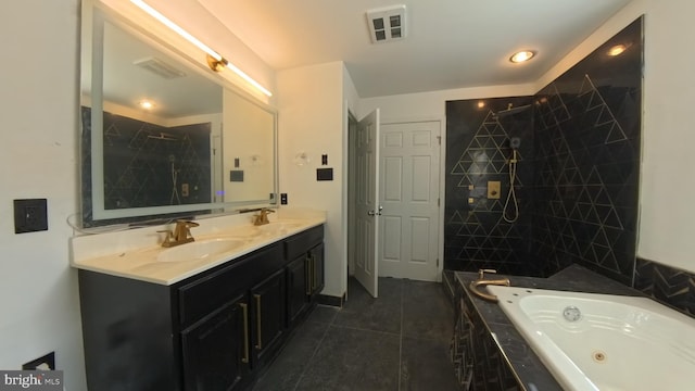 full bathroom featuring visible vents, a sink, a jetted tub, and double vanity