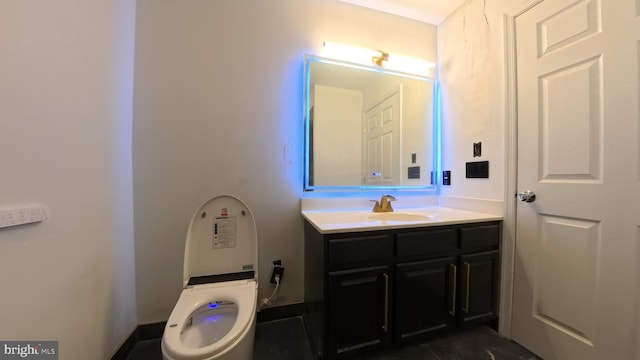 half bathroom featuring toilet and vanity