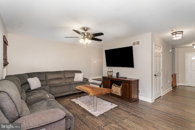 living room with dark hardwood / wood-style floors and ceiling fan