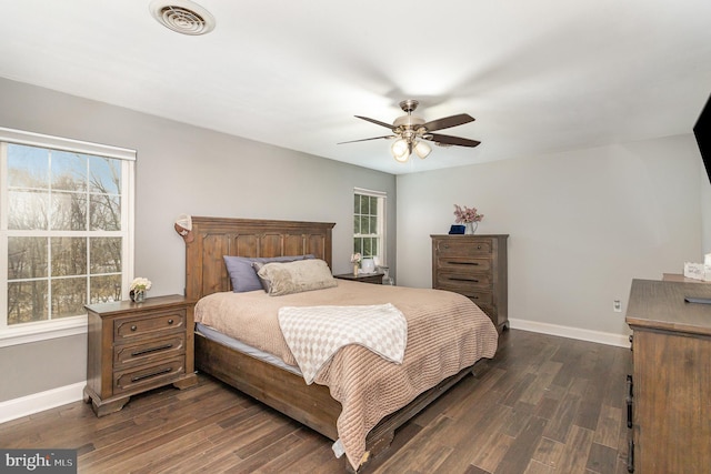 bedroom with ceiling fan and dark hardwood / wood-style floors