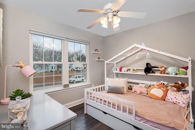 bedroom with ceiling fan and dark hardwood / wood-style flooring