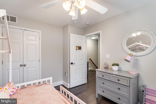 bedroom with ceiling fan, dark hardwood / wood-style flooring, and a closet