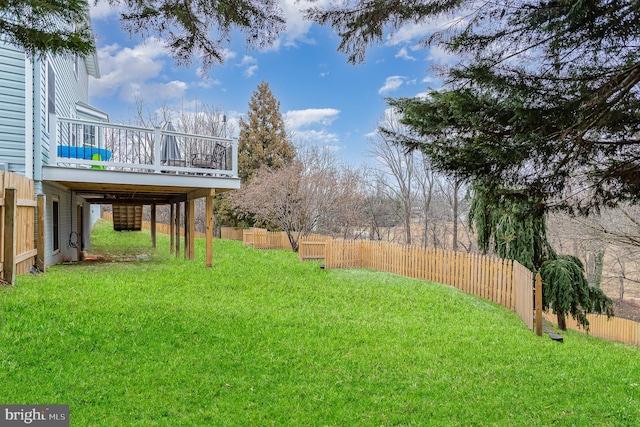 view of yard featuring a wooden deck