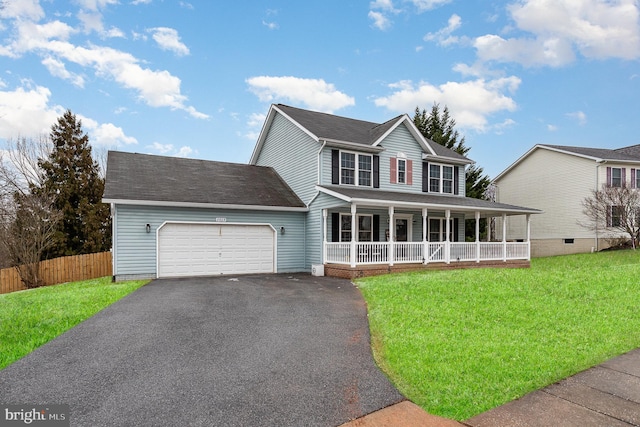 view of front of property with a garage, covered porch, and a front yard