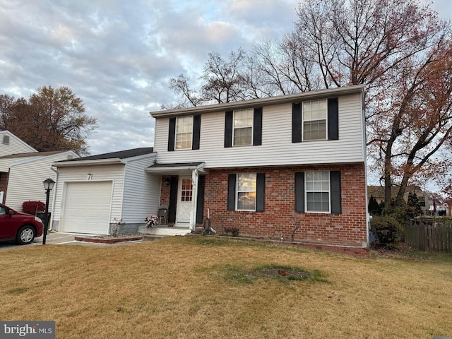 view of property featuring a garage and a front yard