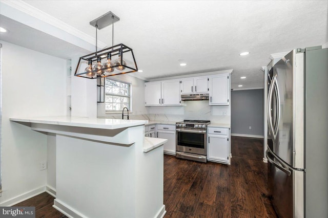 kitchen with pendant lighting, appliances with stainless steel finishes, white cabinetry, dark hardwood / wood-style flooring, and kitchen peninsula