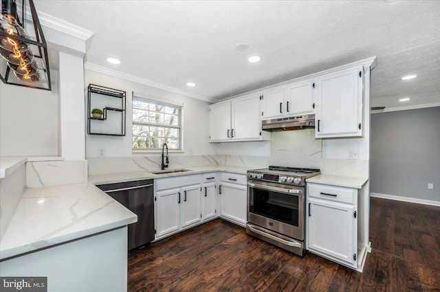 kitchen featuring stainless steel appliances, light stone countertops, sink, and white cabinets