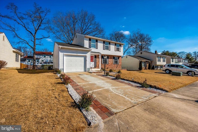 view of front of home featuring a garage and a front yard