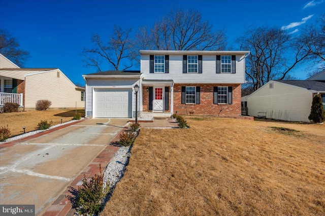 colonial house featuring a garage and a front lawn