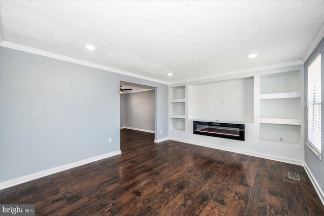 unfurnished living room with ornamental molding, dark hardwood / wood-style floors, a textured ceiling, and built in shelves