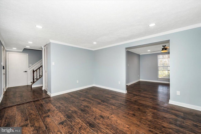 empty room with crown molding, a textured ceiling, and dark hardwood / wood-style flooring