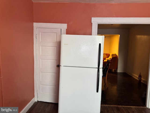 kitchen featuring dark wood-type flooring and white fridge