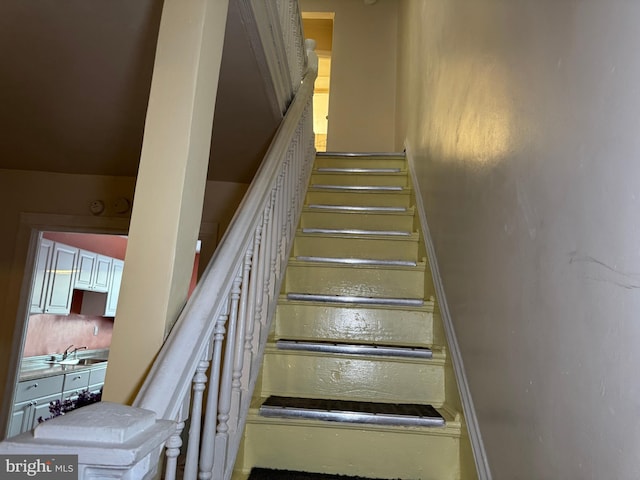 staircase with sink