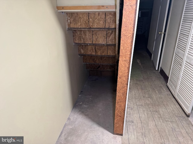 hallway with wood-type flooring