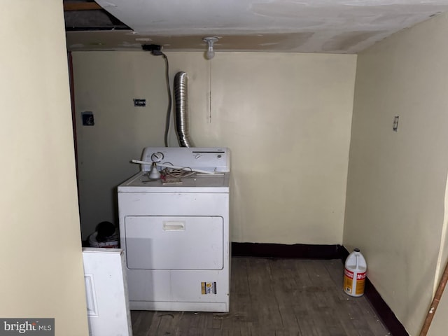 washroom with washer / clothes dryer and dark hardwood / wood-style floors