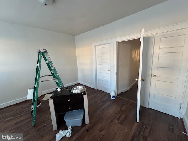 interior space with dark hardwood / wood-style flooring