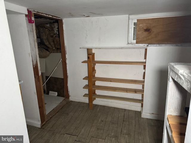 basement with dark wood-type flooring