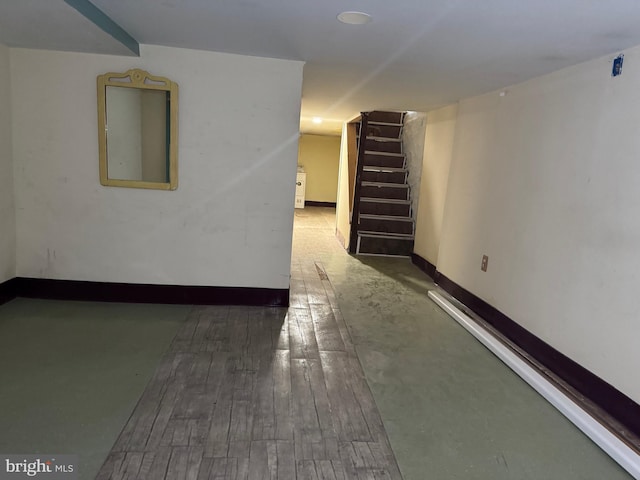 basement featuring dark hardwood / wood-style floors