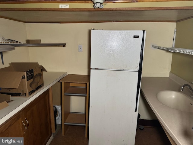 kitchen with white fridge and sink