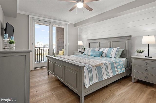 bedroom featuring ornamental molding, access to outside, ceiling fan, a textured ceiling, and light hardwood / wood-style flooring