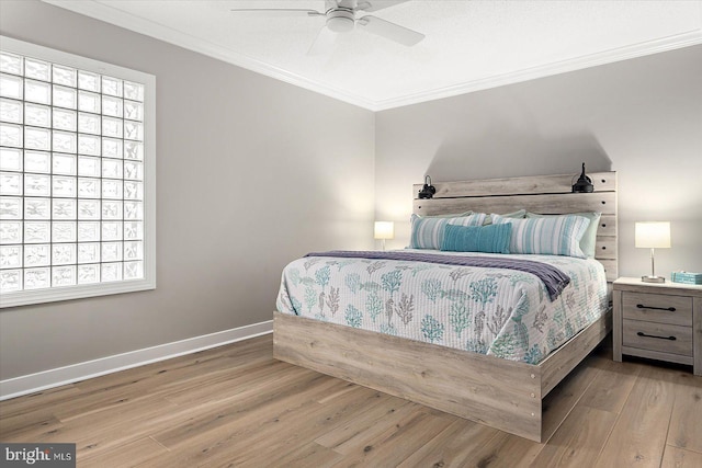 bedroom with ornamental molding, ceiling fan, and light hardwood / wood-style floors