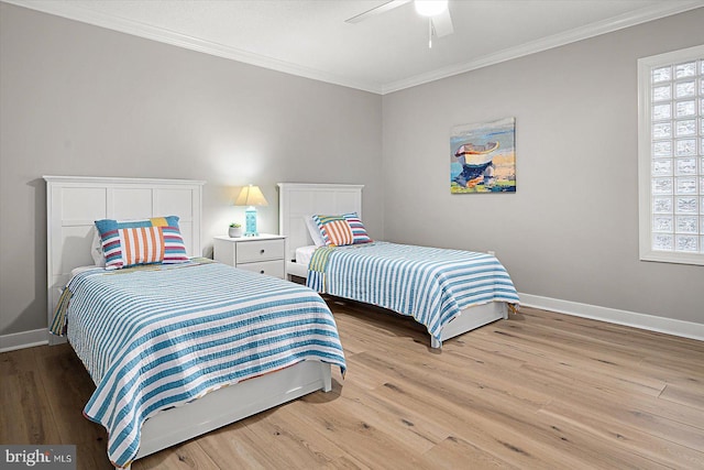 bedroom with ceiling fan, ornamental molding, and light wood-type flooring