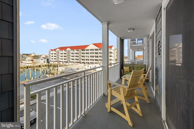 balcony featuring a water view