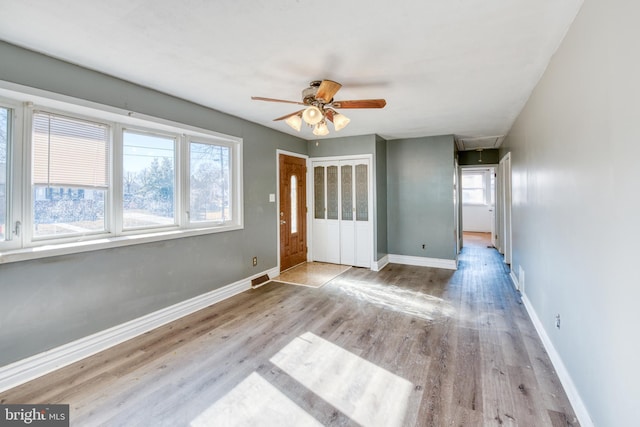 interior space with ceiling fan, a healthy amount of sunlight, and light hardwood / wood-style flooring