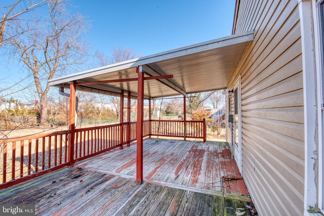 wooden terrace featuring ceiling fan