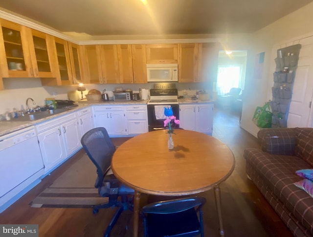 kitchen with sink, dark wood-type flooring, white cabinets, and white appliances