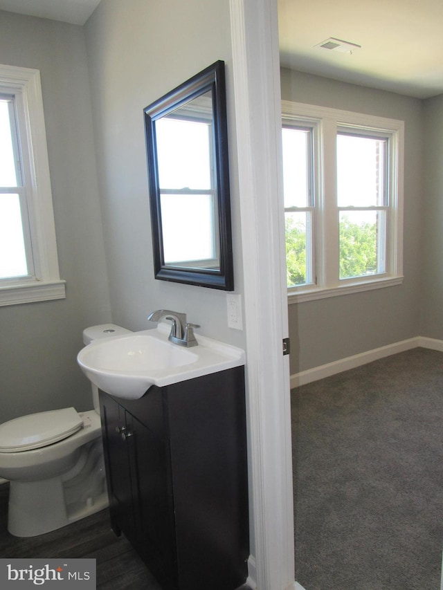 bathroom with vanity and toilet