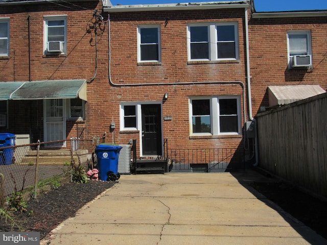 rear view of property featuring cooling unit and central AC unit