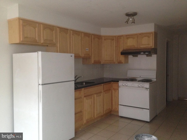 kitchen with white appliances, sink, light brown cabinets, and exhaust hood