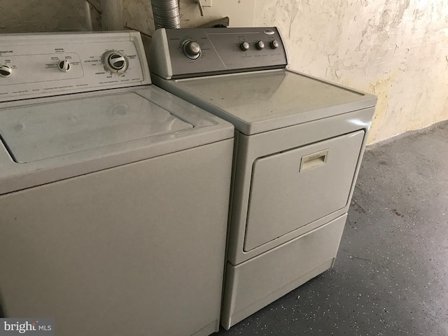 washroom with separate washer and dryer