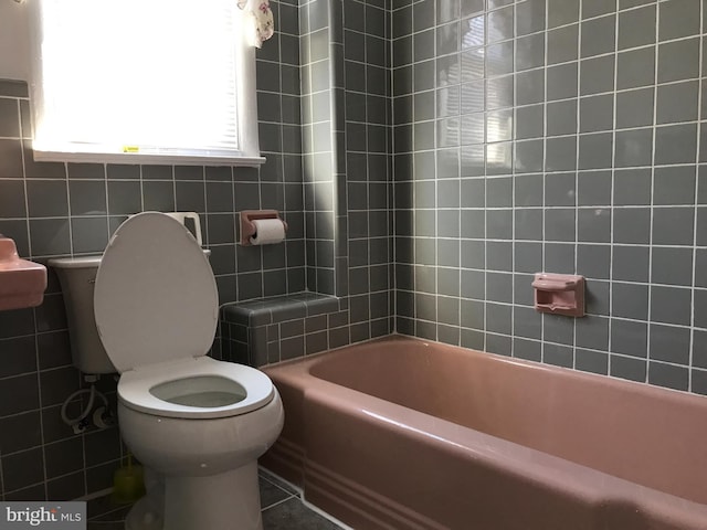 bathroom featuring tile patterned floors and toilet