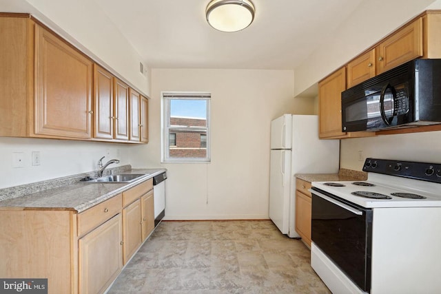 kitchen featuring white appliances, a sink, visible vents, baseboards, and light countertops