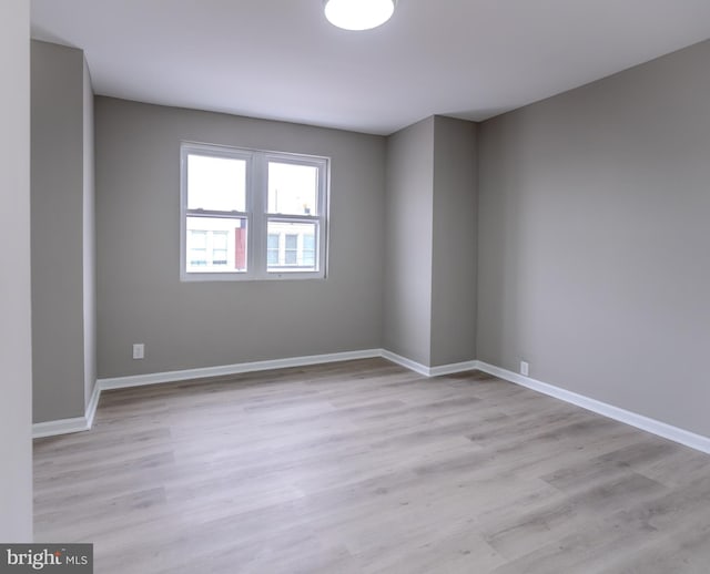 spare room with light wood-type flooring