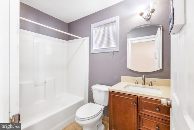 full bathroom featuring washtub / shower combination, vanity, and toilet