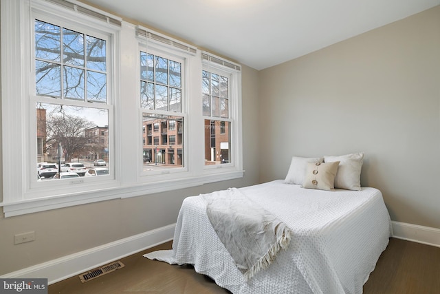 bedroom featuring dark hardwood / wood-style floors