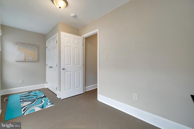 unfurnished bedroom with a closet