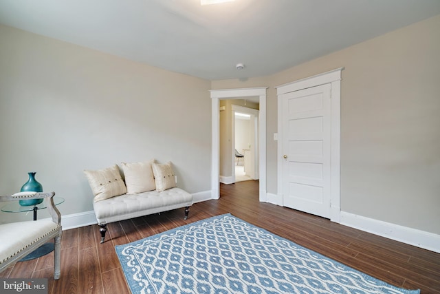 living area with dark hardwood / wood-style floors