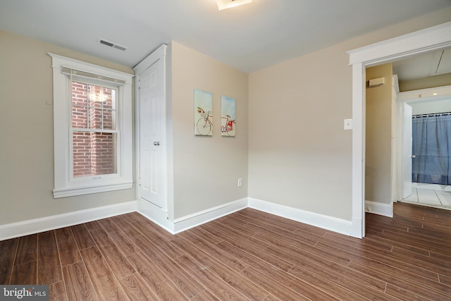 empty room featuring hardwood / wood-style floors